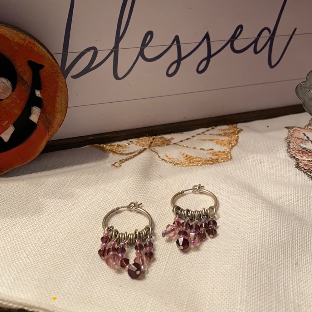 Silver tone hoop earrings with purple bobbles